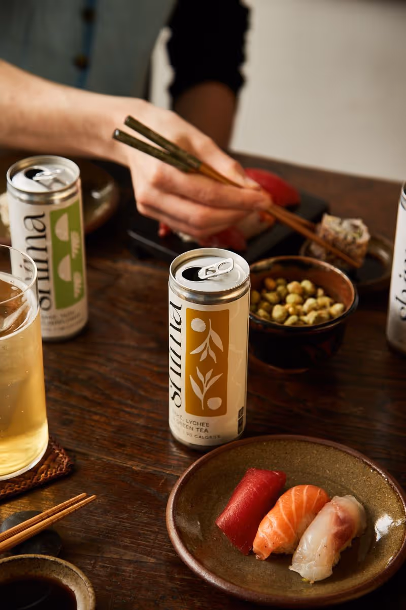 A man eating food while drinking shima
